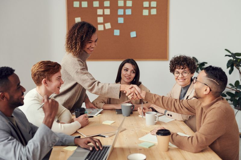 A diverse professional team meeting around a boardroom table